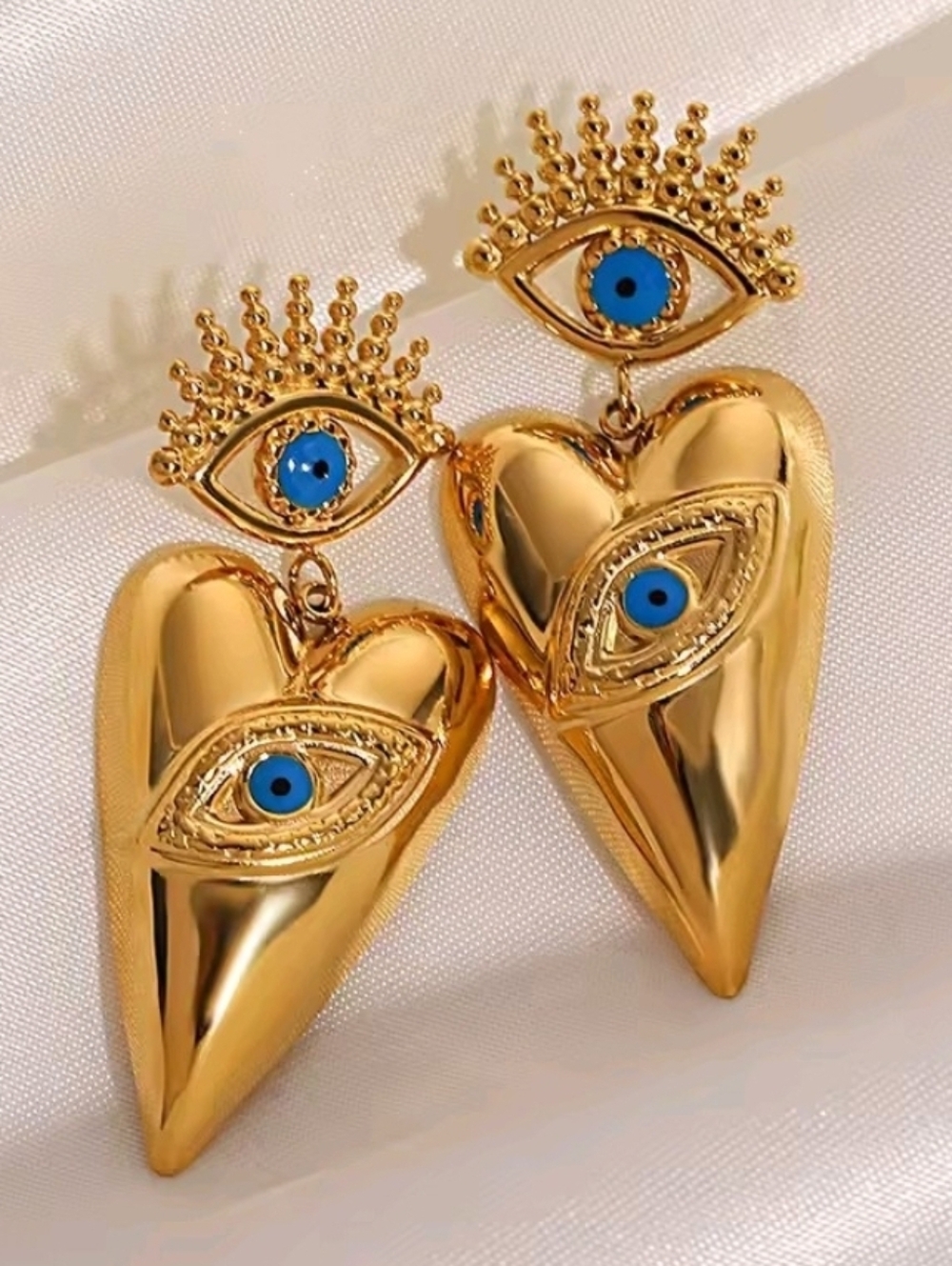 Gold Heart Drop Earrings with Blue Eye Accents
